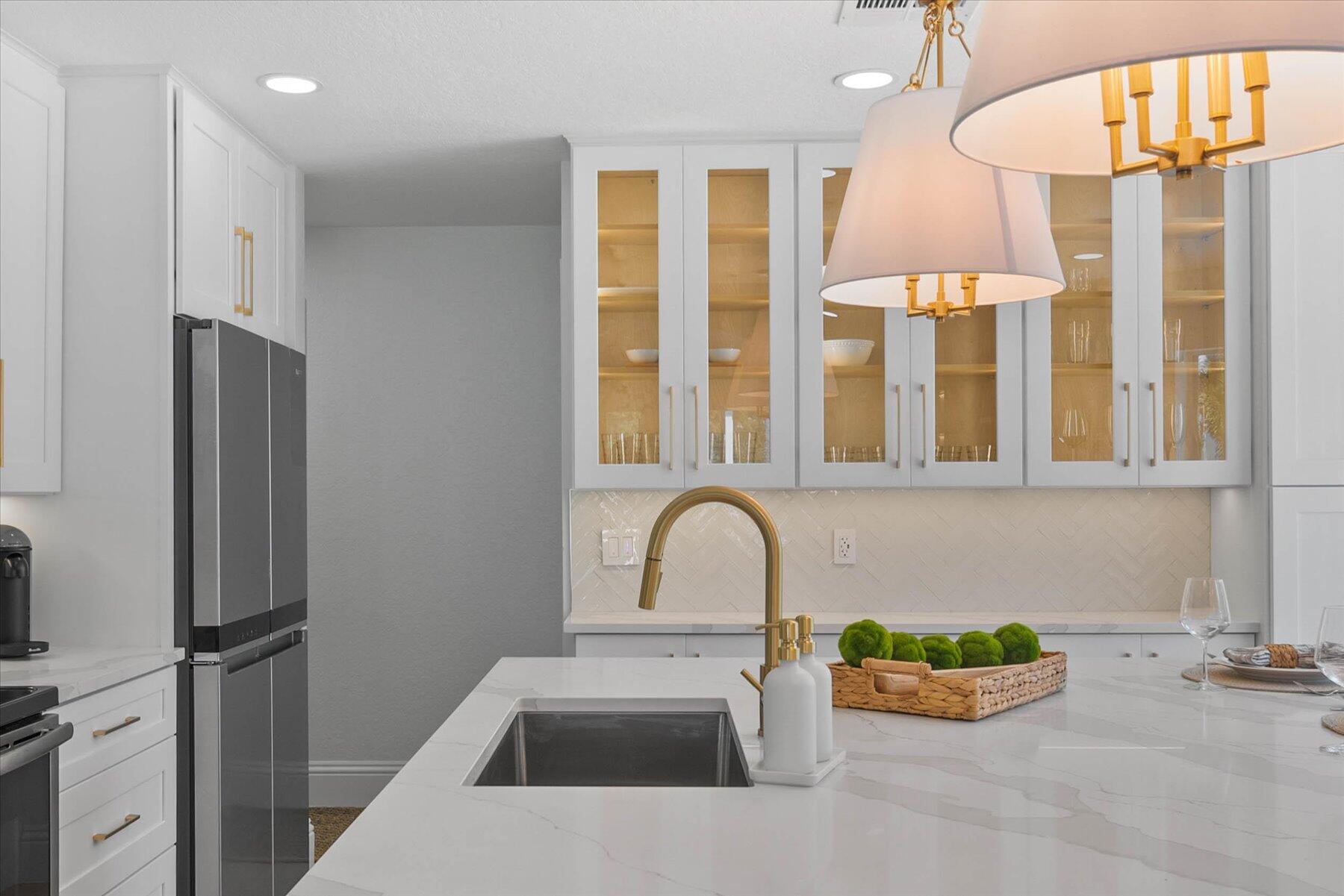 4185 Sea Mist Way Wellington, FL 33449 - Photo 14 of 50 a kitchen with a refrigerator and a sink