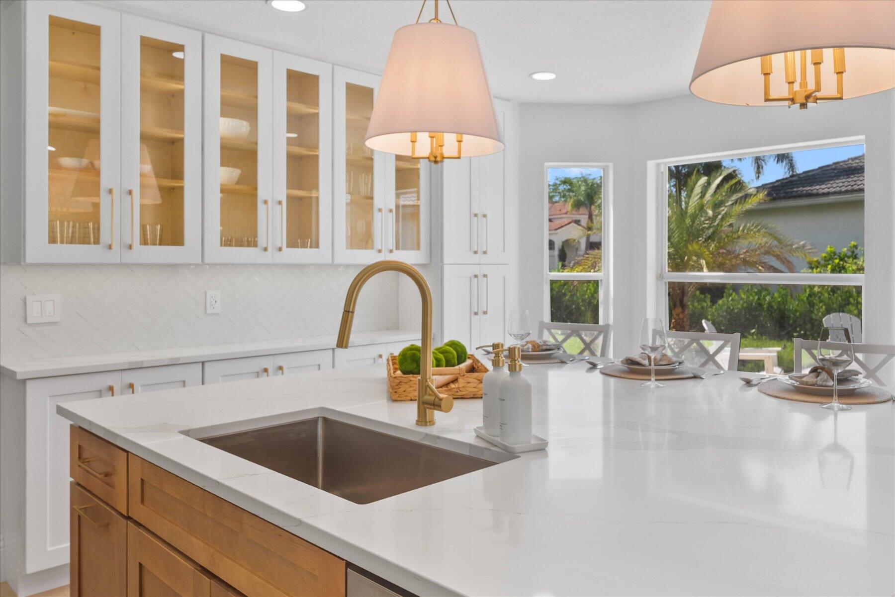 4185 Sea Mist Way Wellington, FL 33449 - Photo 17 of 50 a kitchen with a sink and a refrigerator