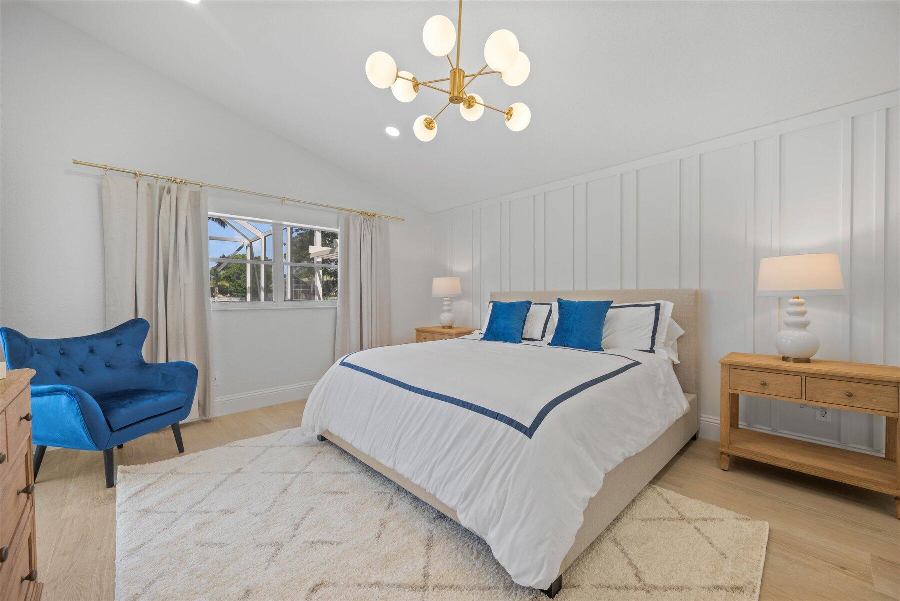 4185 Sea Mist Way Wellington, FL 33449 - Photo 21 of 50 a bedroom with a bed and a couch