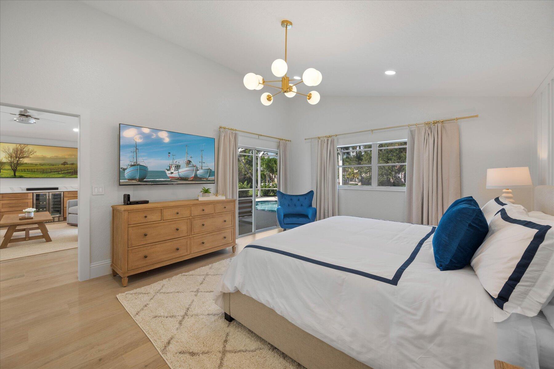 4185 Sea Mist Way Wellington, FL 33449 - Photo 22 of 50 a living room with furniture and a flat screen tv