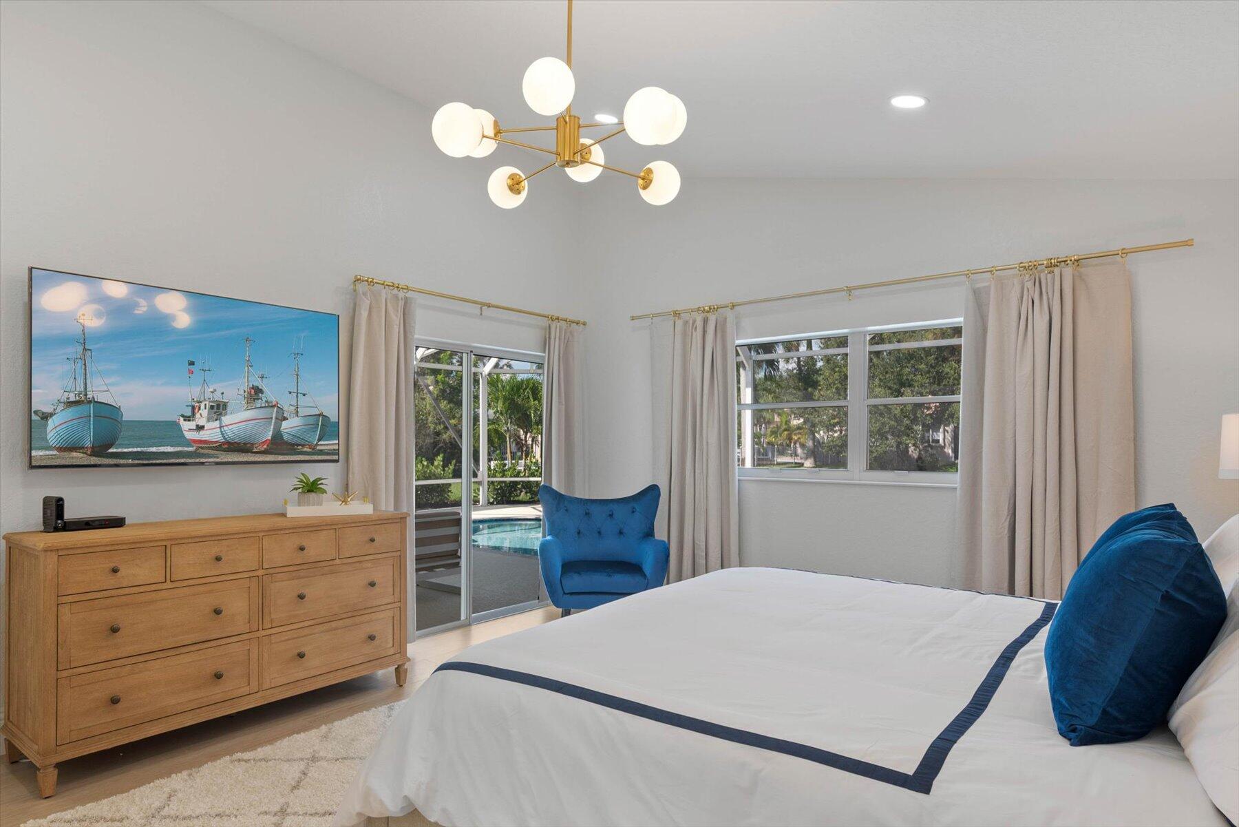 4185 Sea Mist Way Wellington, FL 33449 - Photo 23 of 50 a bed room with a bed and a painting on the wall