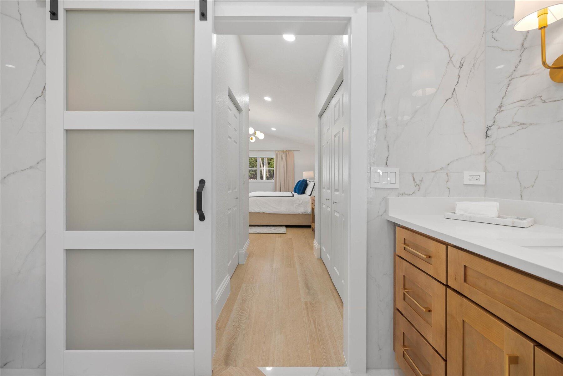 4185 Sea Mist Way Wellington, FL 33449 - Photo 29 of 50 a view of a bathroom with sink and mirror