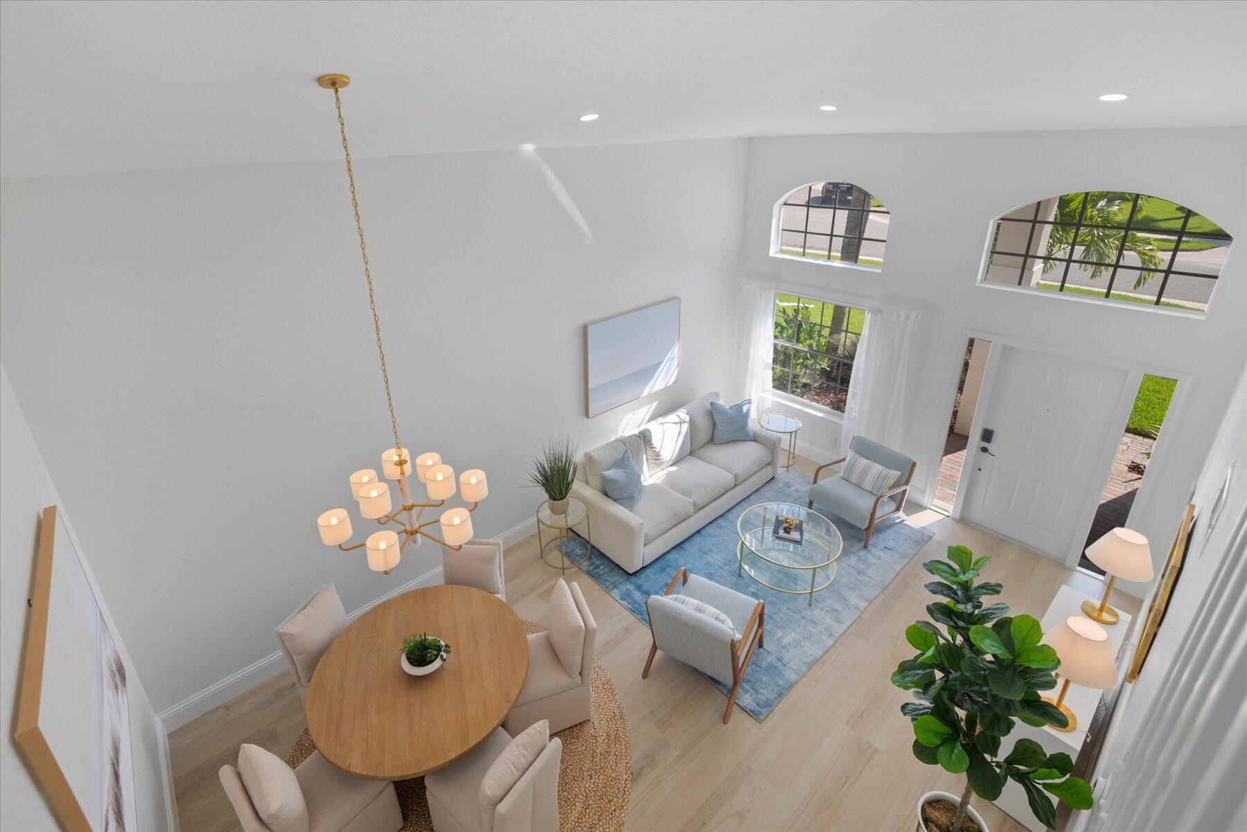 4185 Sea Mist Way Wellington, FL 33449 - Photo 31 of 50 a living room with furniture and flowers