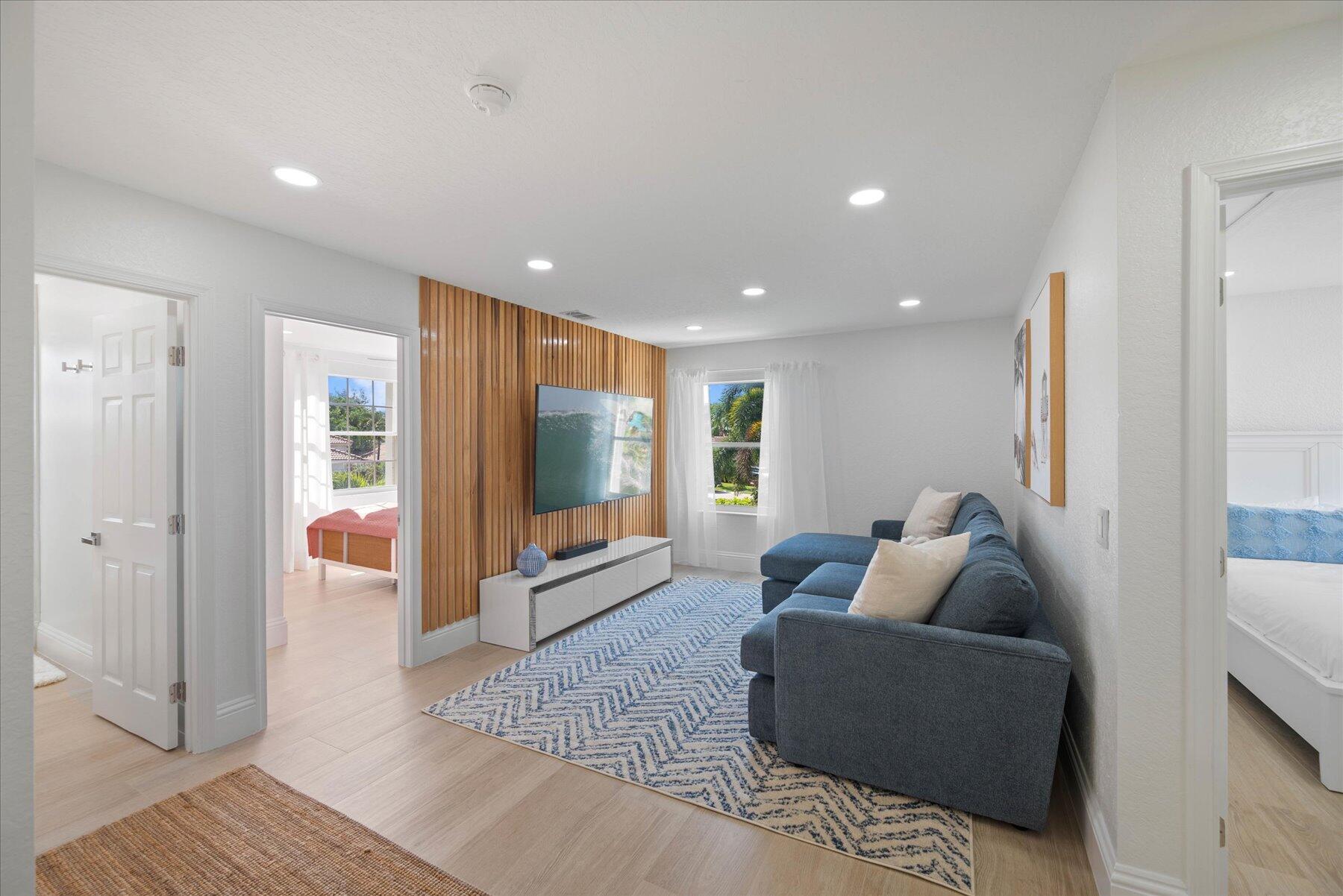 4185 Sea Mist Way Wellington, FL 33449 - Photo 32 of 50 a living room with furniture and a flat screen tv