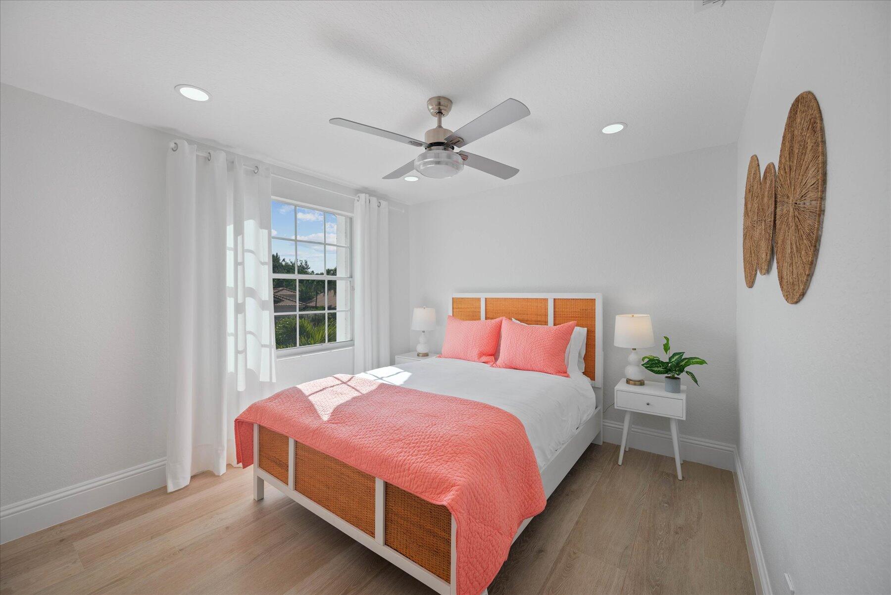 4185 Sea Mist Way Wellington, FL 33449 - Photo 38 of 50 a bedroom with a bed and a window