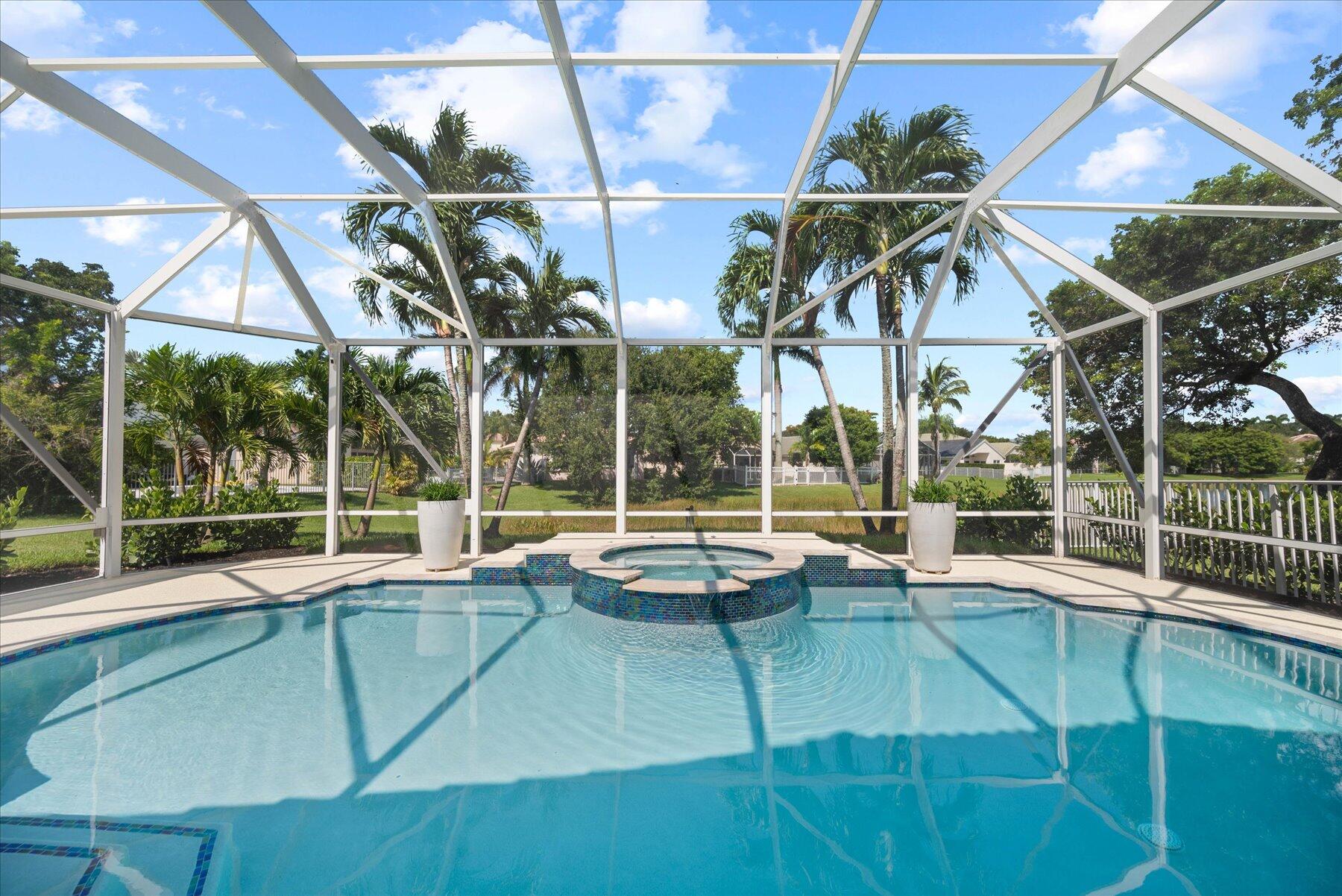 4185 Sea Mist Way Wellington, FL 33449 - Photo 43 of 50 a view of a backyard with a swimming pool