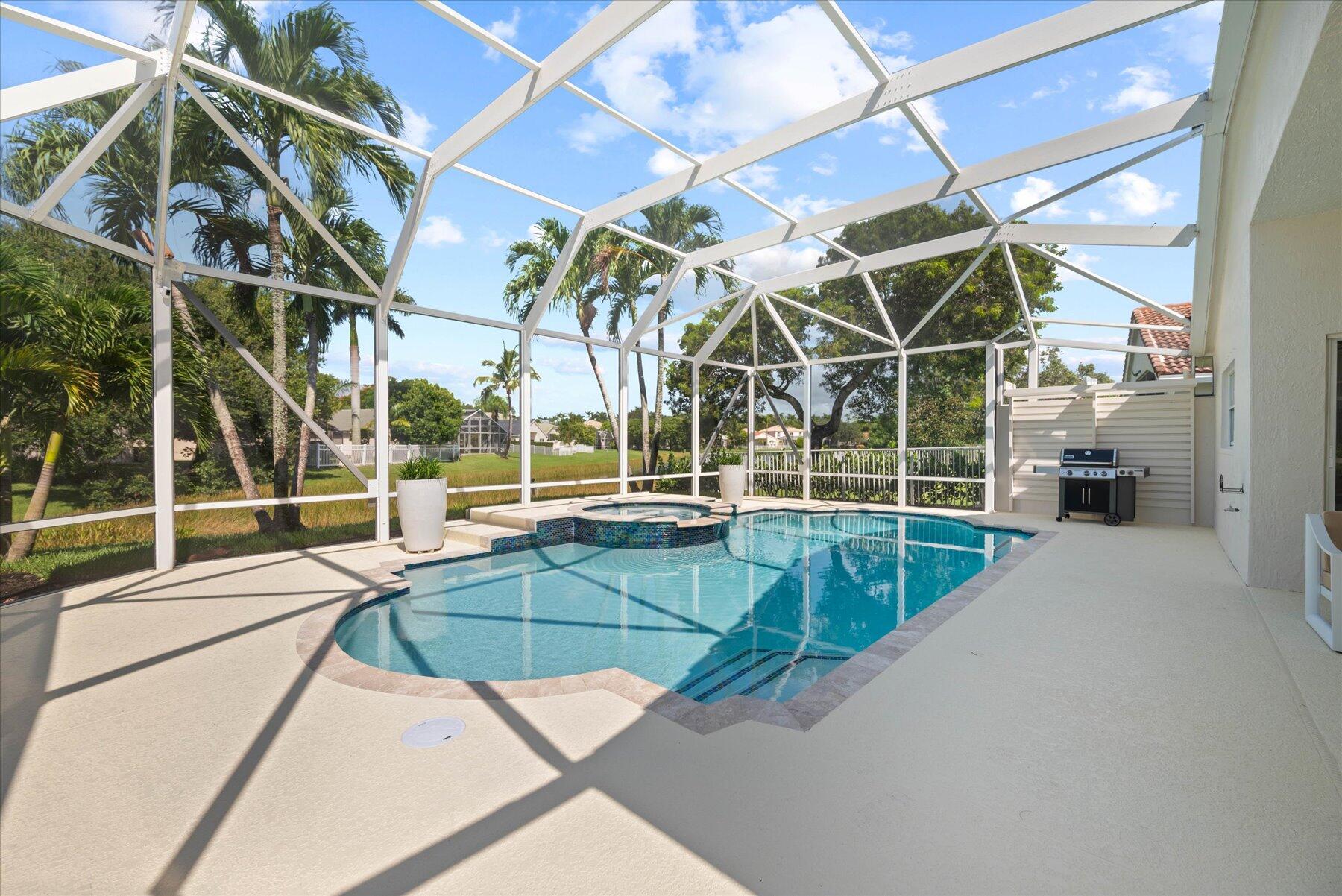 4185 Sea Mist Way Wellington, FL 33449 - Photo 44 of 50 a view of a tennis room with windows