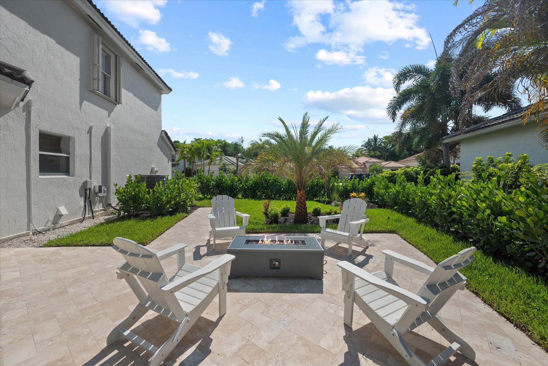 4185 Sea Mist Way Wellington, FL 33449 - Photo 46 of 50 a view of yard with seating area and green space