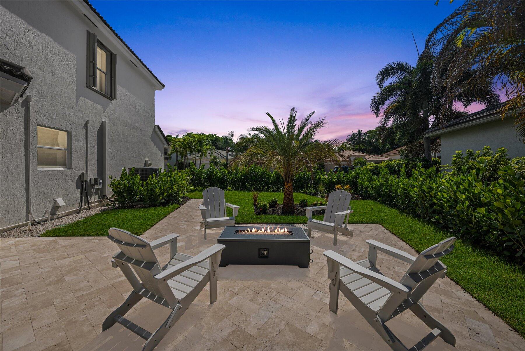 4185 Sea Mist Way Wellington, FL 33449 - Photo 49 of 50 a view of a patio with a yard