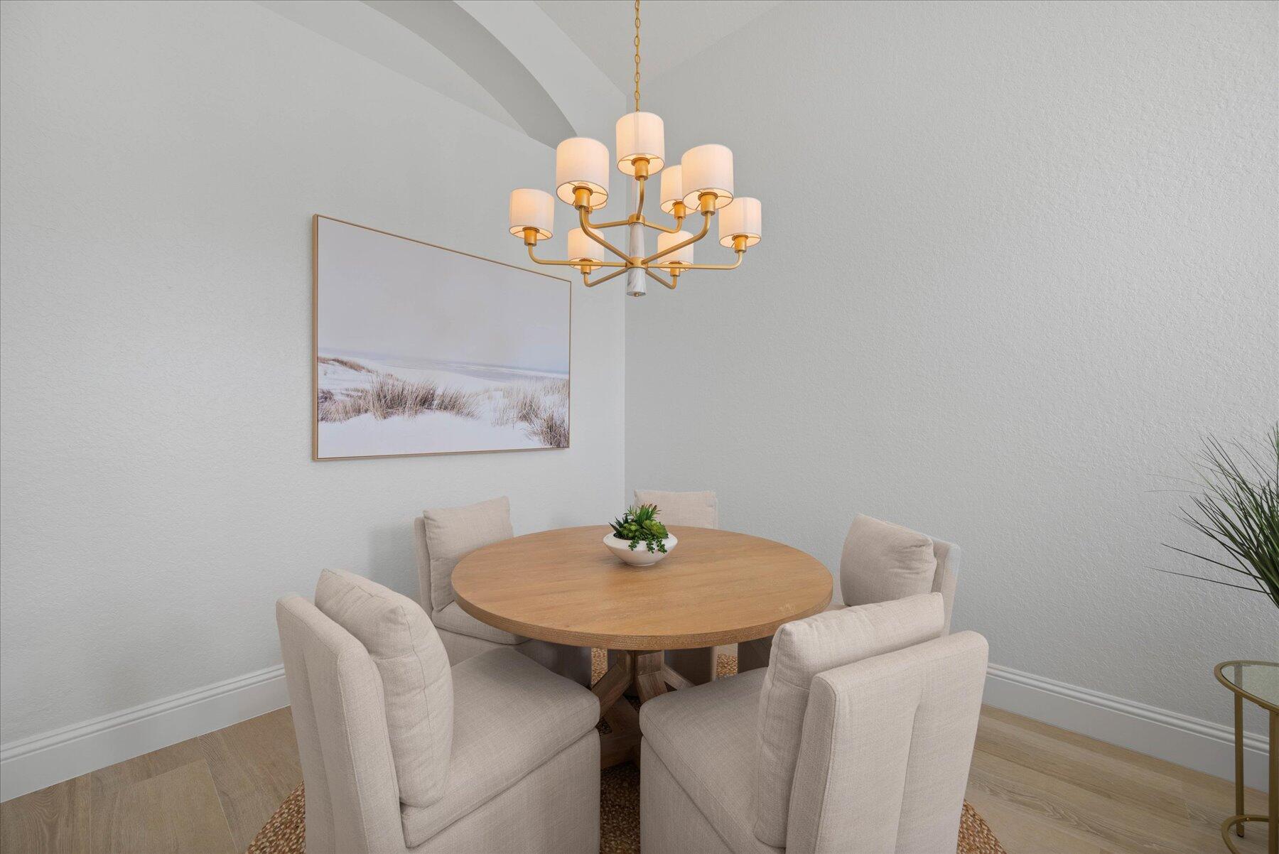 4185 Sea Mist Way Wellington, FL 33449 - Photo 5 of 50 a dining room with a table and chandelier