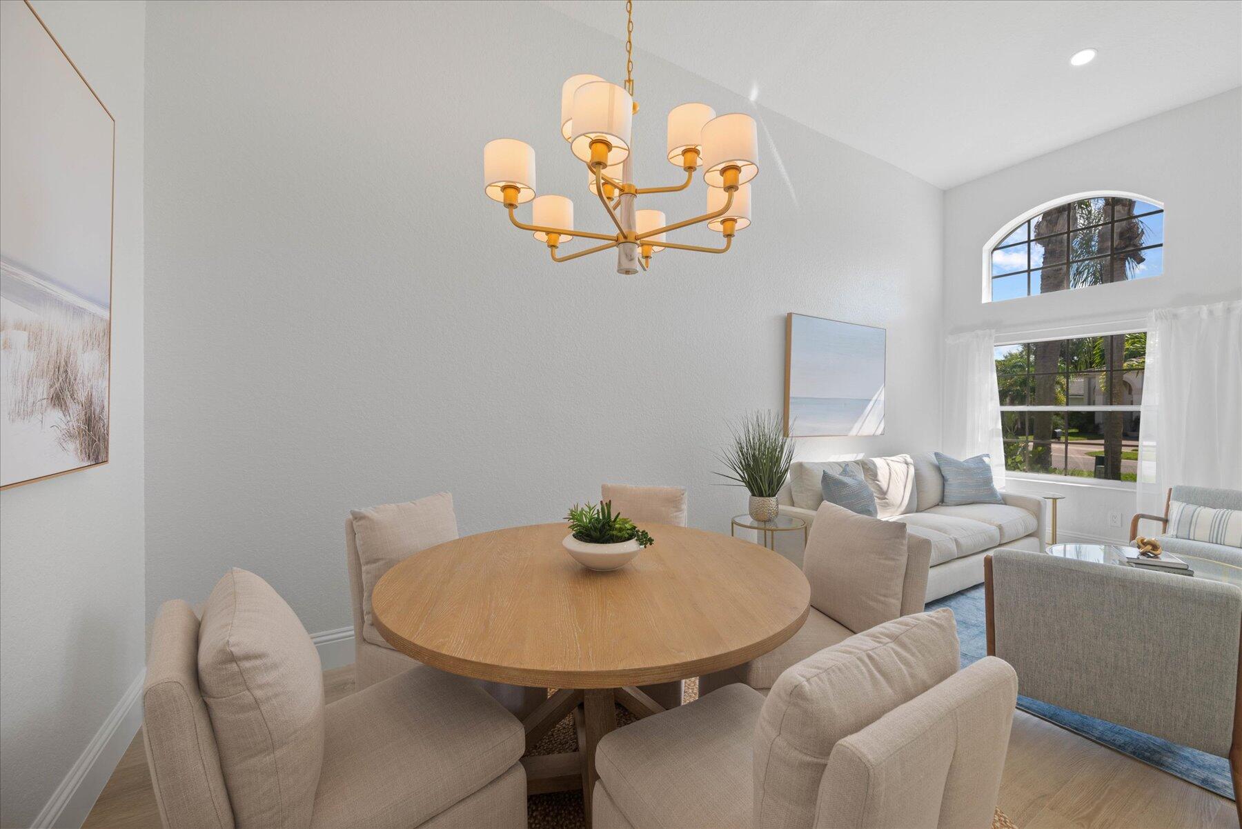 4185 Sea Mist Way Wellington, FL 33449 - Photo 6 of 50 a view of a dining room with furniture and window
