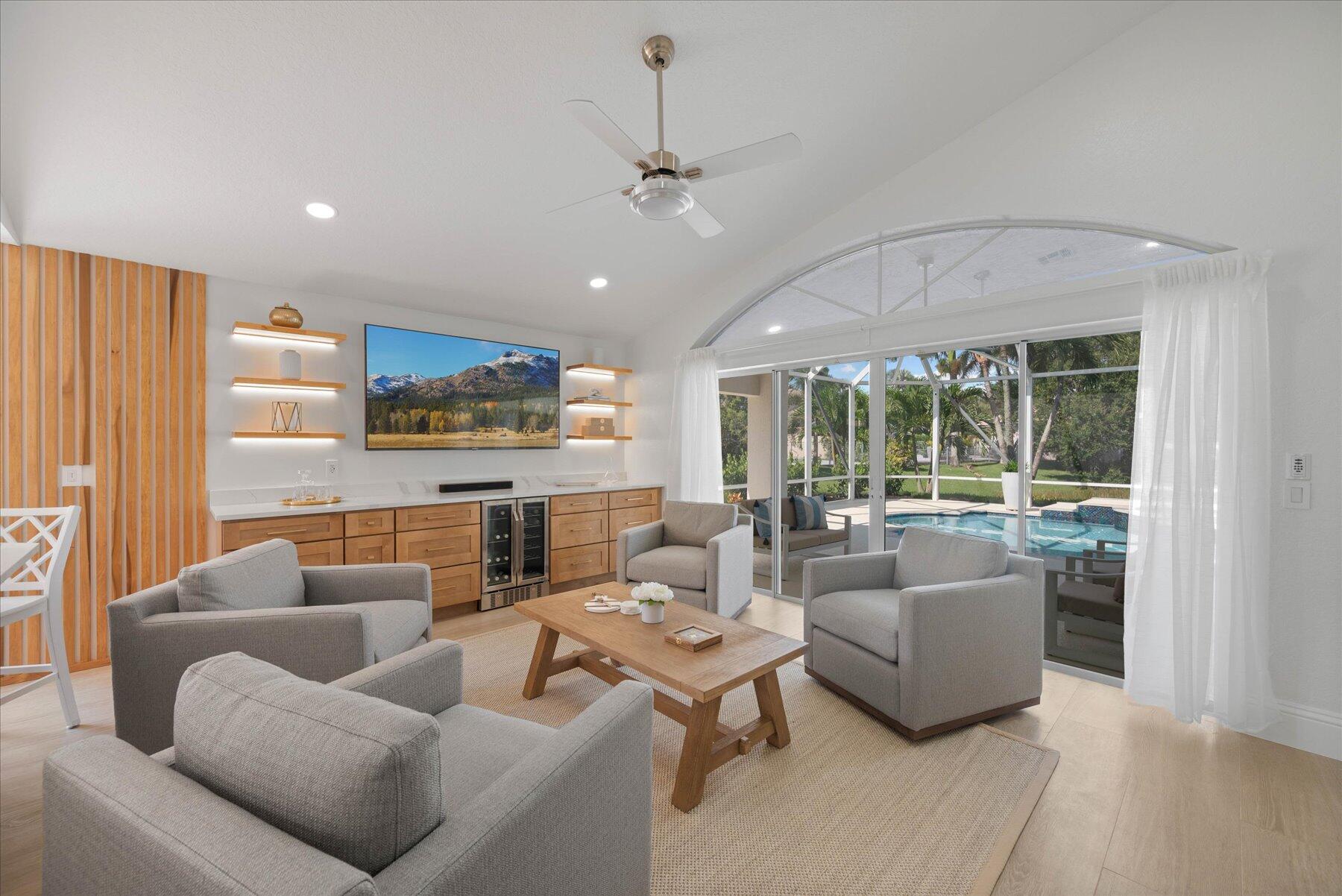 4185 Sea Mist Way Wellington, FL 33449 - Photo 9 of 50 a living room with furniture and a large window