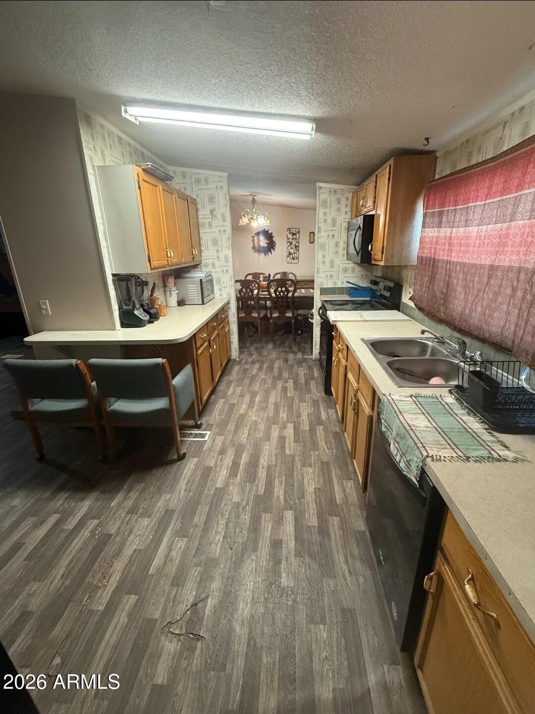 2625 Saddle Vista Road Tonopah, AZ 85354 - Photo 18 of 19 a kitchen with a stove and a sink