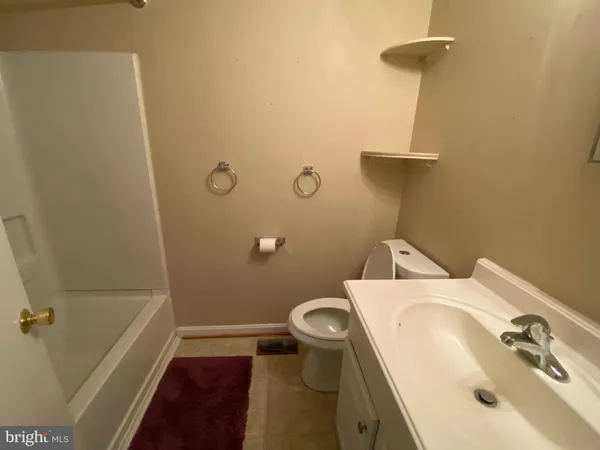 a bathroom with a sink and toilet