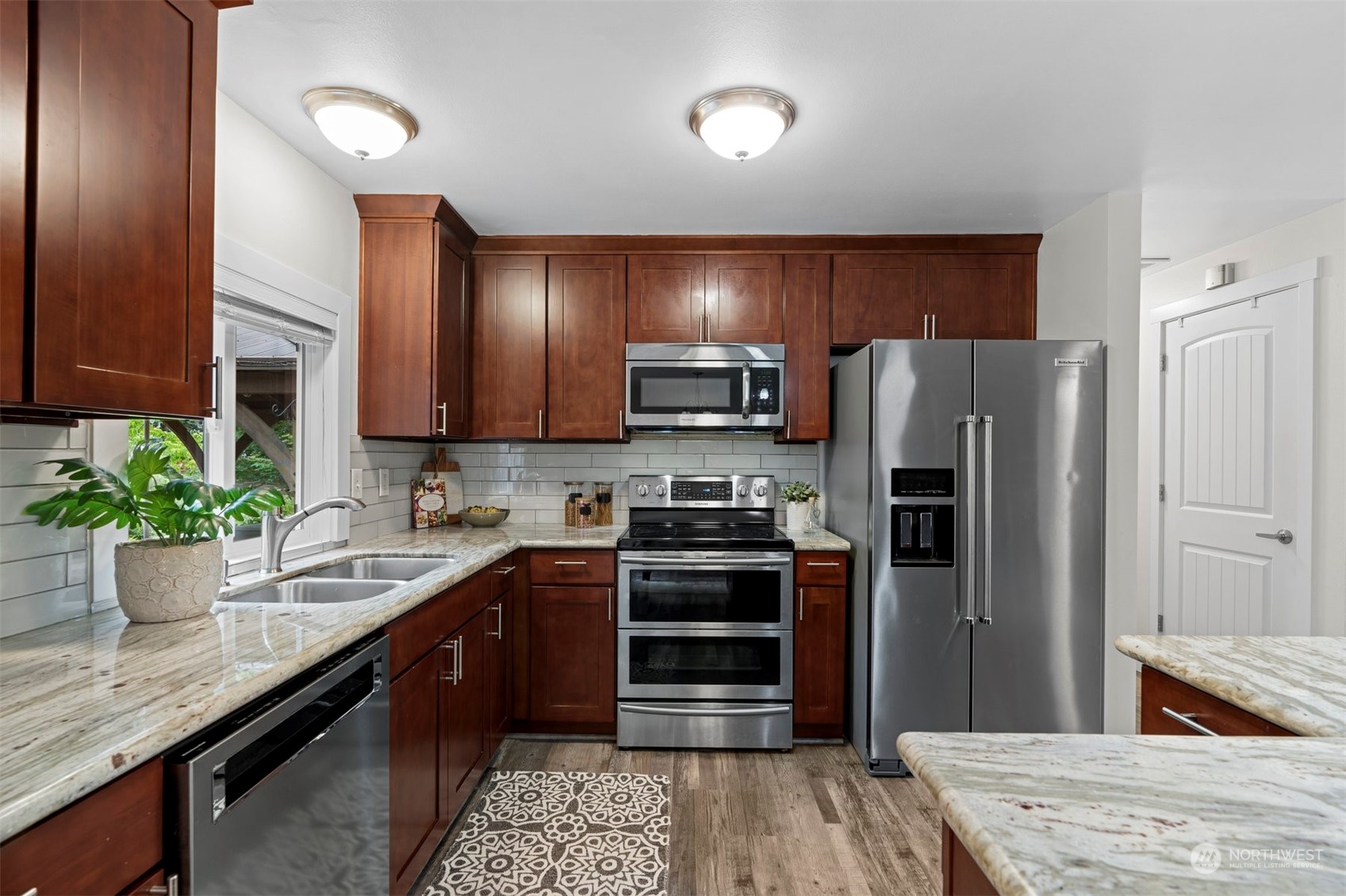 24301 7th Place West Bothell, WA 98021 - Photo 11 of 40 a kitchen with a refrigerator sink and microwave