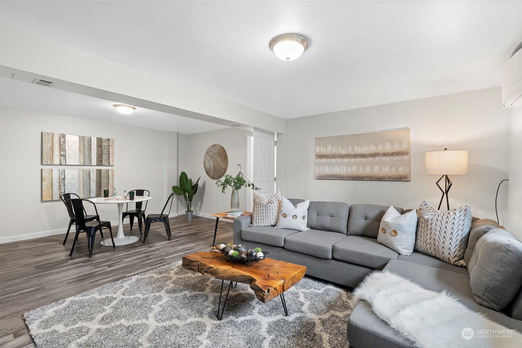 24301 7th Place West Bothell, WA 98021 - Photo 18 of 40 a living room with furniture a wooden floor and a table