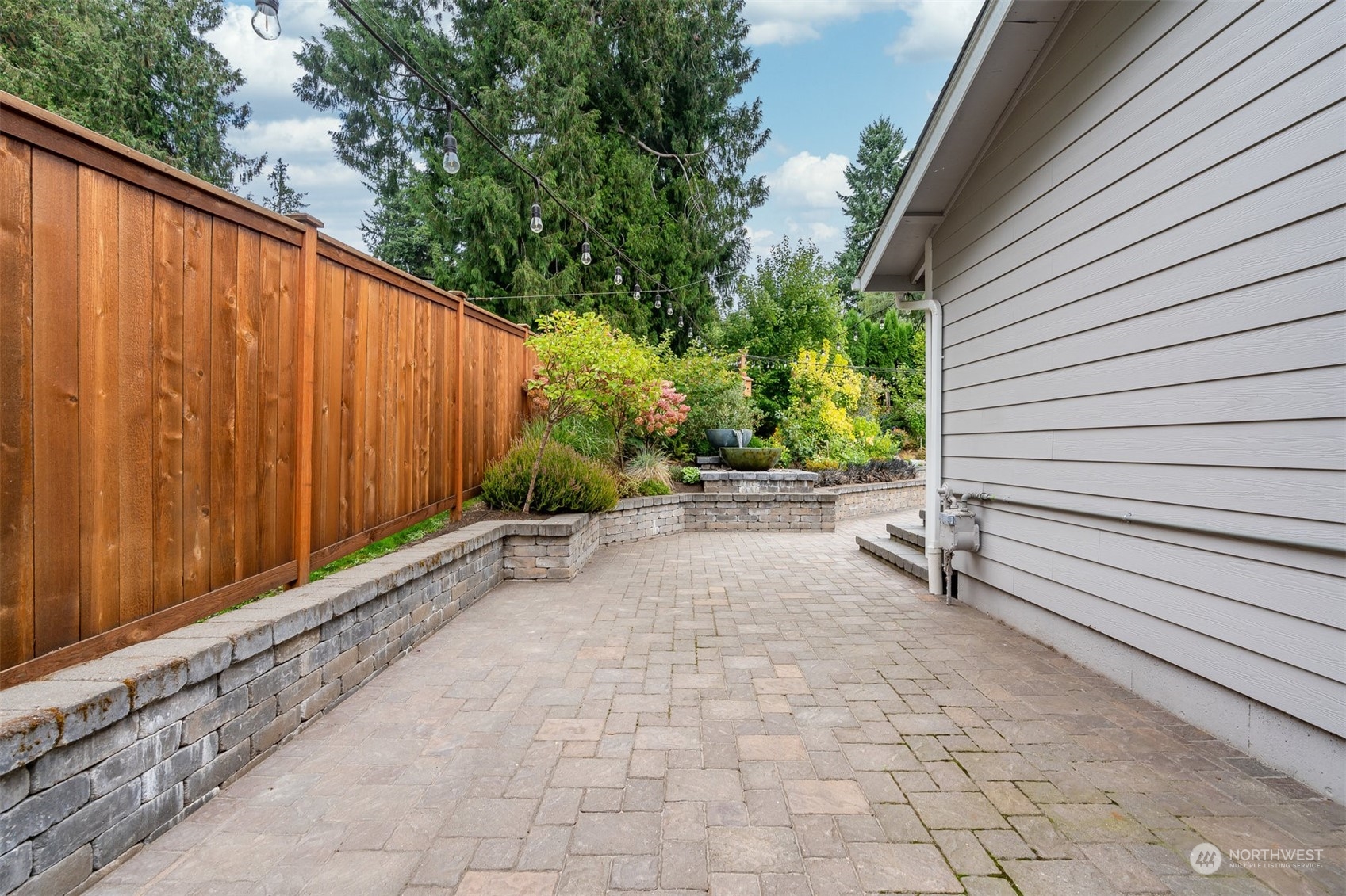 24301 7th Place West Bothell, WA 98021 - Photo 29 of 40 a view of a backyard with pathway and a porch
