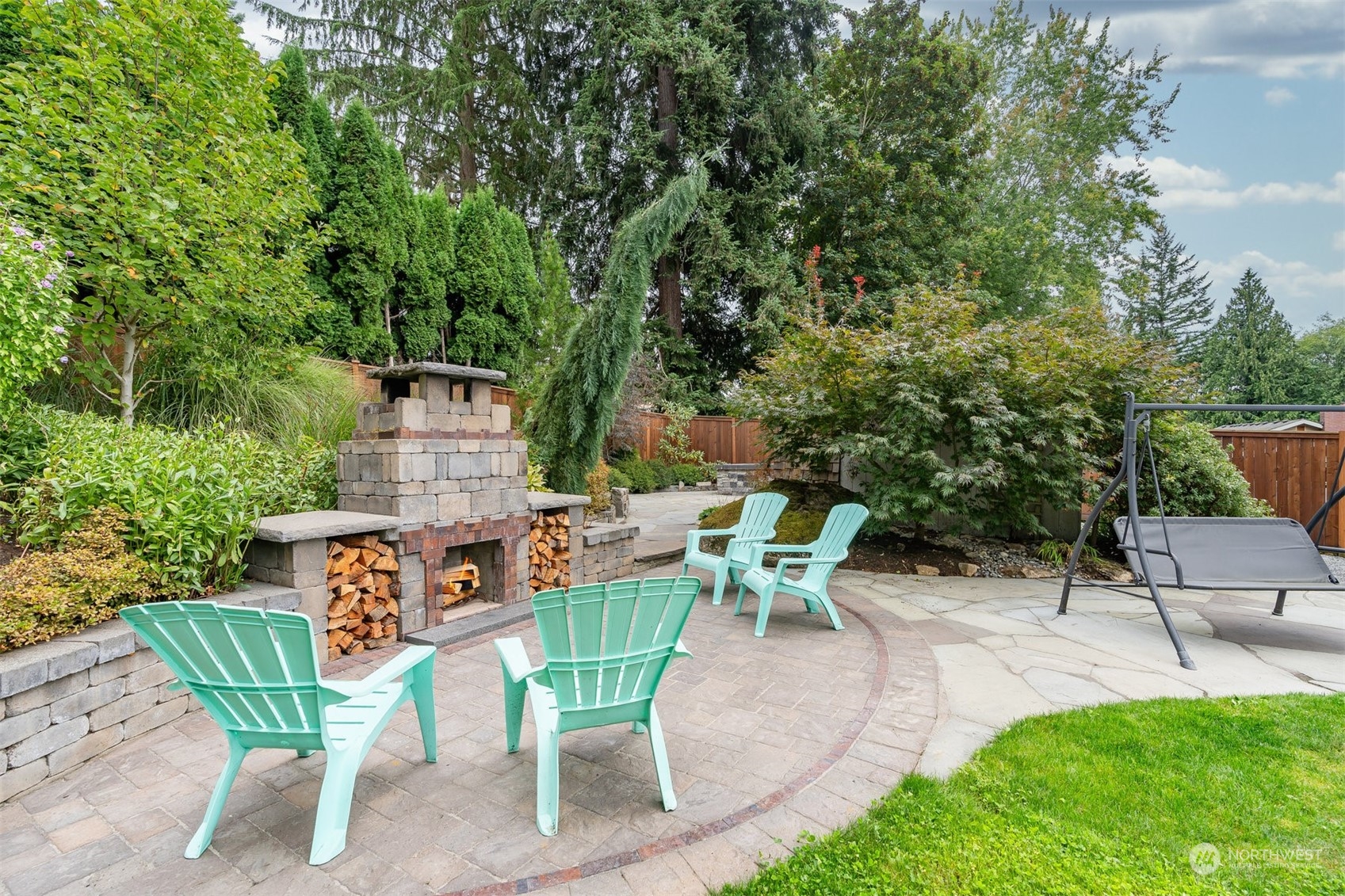 24301 7th Place West Bothell, WA 98021 - Photo 30 of 40 an outdoor sitting area with furniture and garden