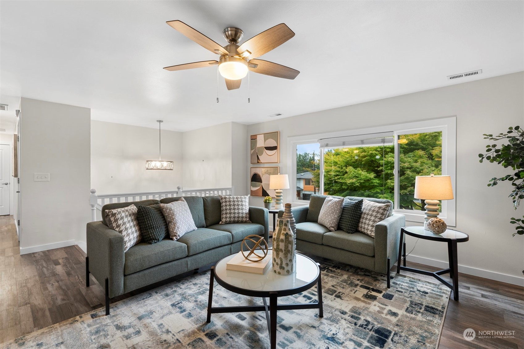 24301 7th Place West Bothell, WA 98021 - Photo 5 of 40 a living room with furniture a rug and a large window