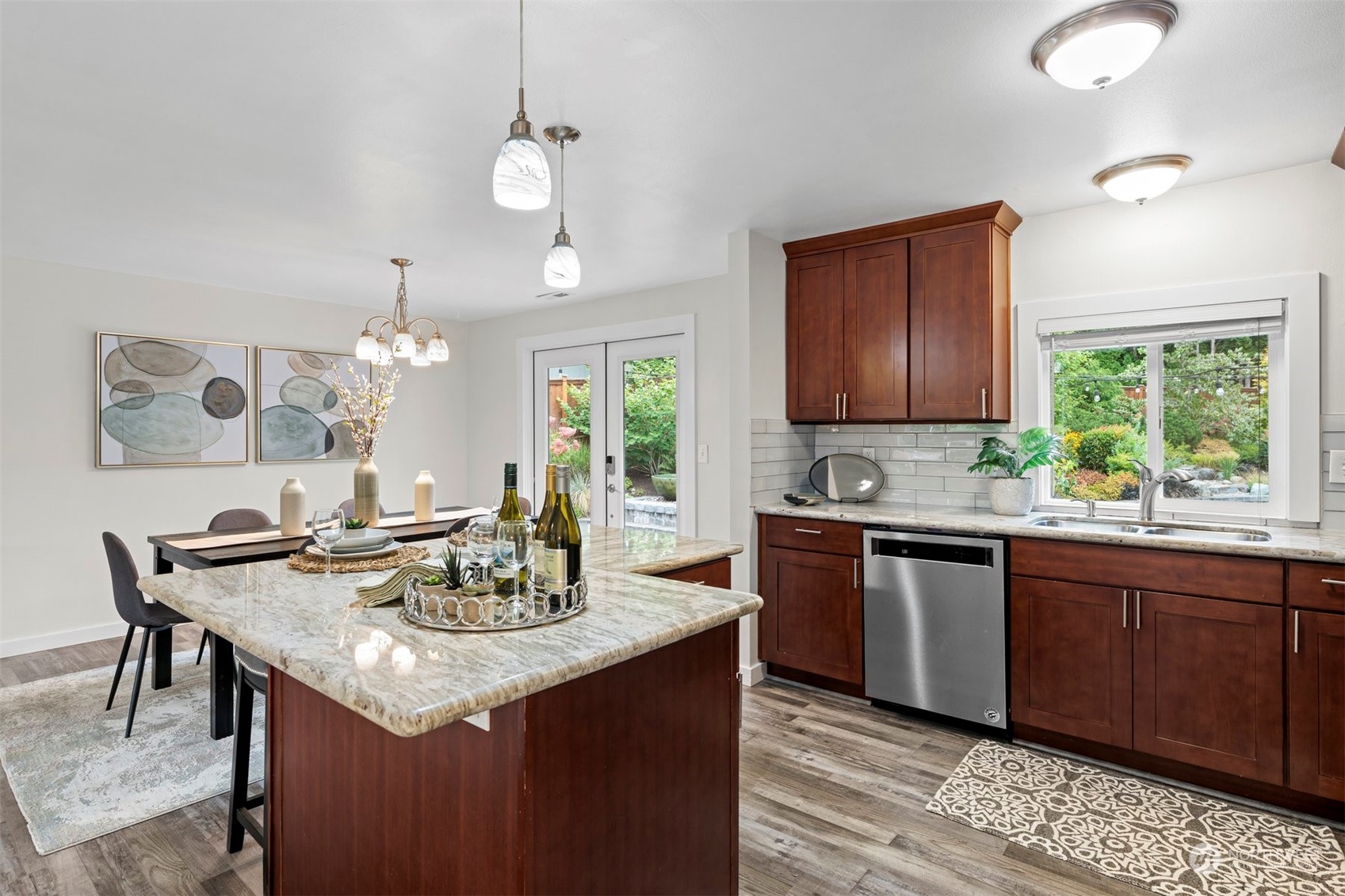 24301 7th Place West Bothell, WA 98021 - Photo 10 of 40 a kitchen with granite countertop sink stove and dining table