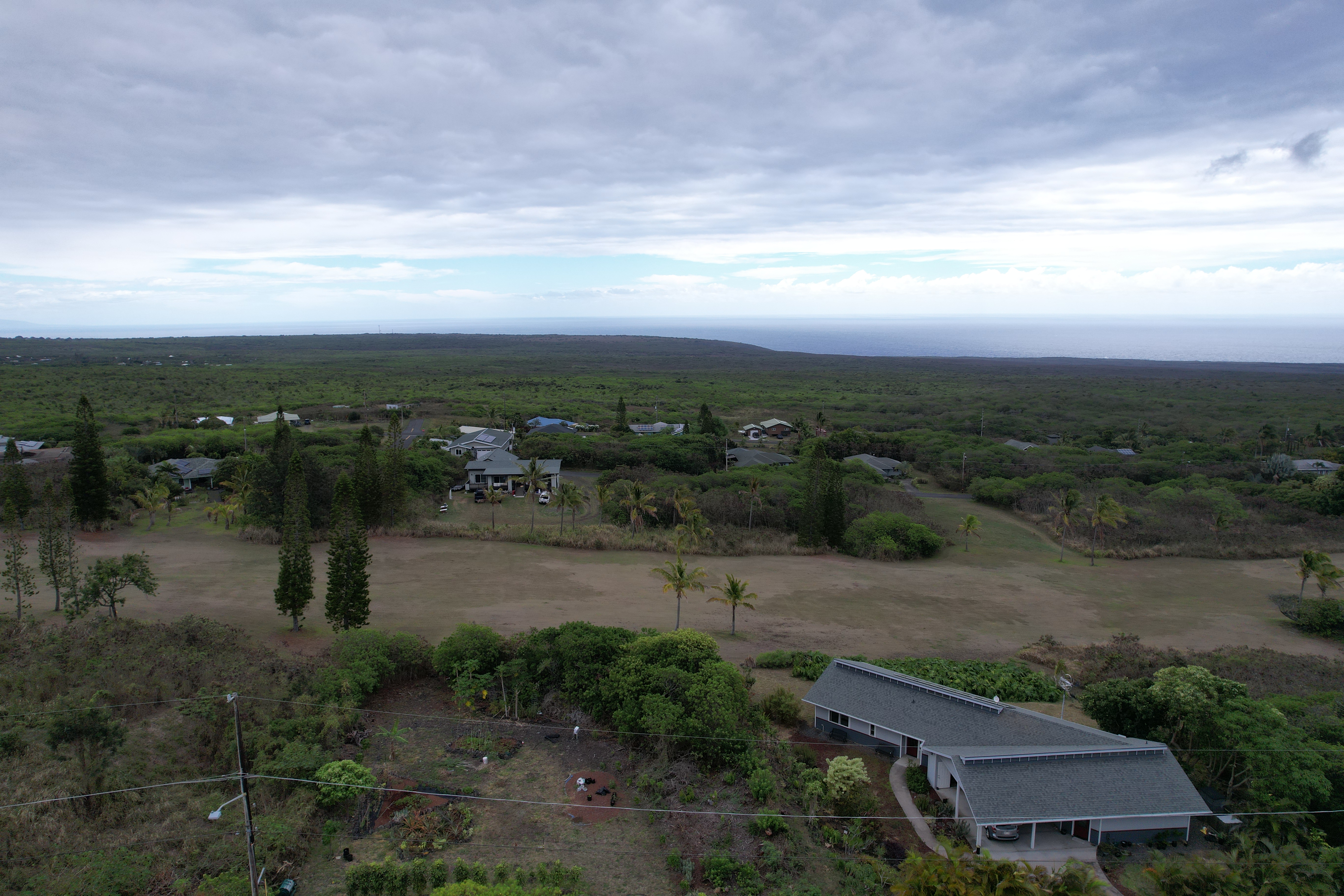 115 Kaulua Circle Naalehu, HI 96772 - Photo 5 of 9 a view of a lake with outdoor space