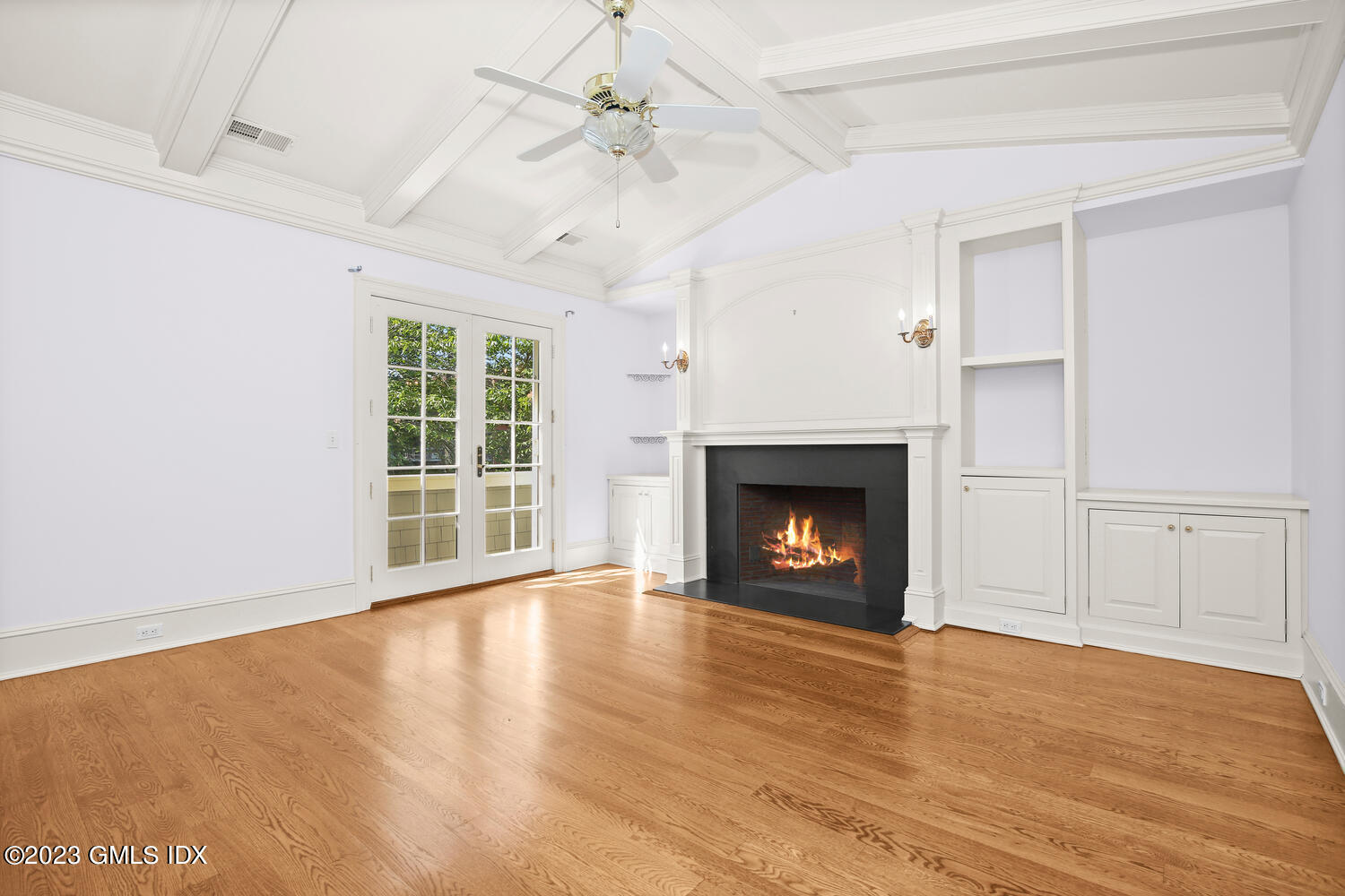 100 East Elm Street, Unit 1 Greenwich, CT 06830 - Photo 12 of 27 a view of an empty room with a fireplace and a window