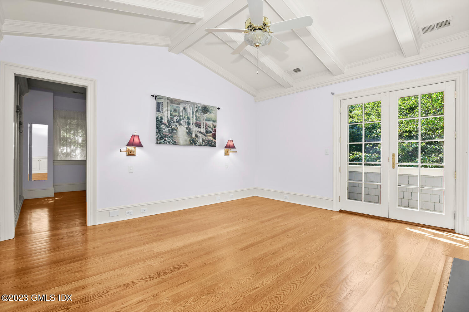 100 East Elm Street, Unit 1 Greenwich, CT 06830 - Photo 13 of 27 a view of an empty room with window and wooden floor