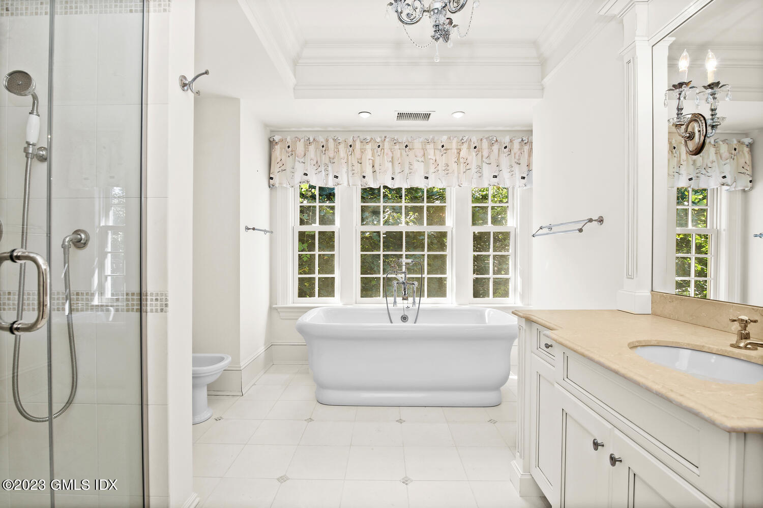 100 East Elm Street, Unit 1 Greenwich, CT 06830 - Photo 14 of 27 a bathroom with a tub sink and mirror