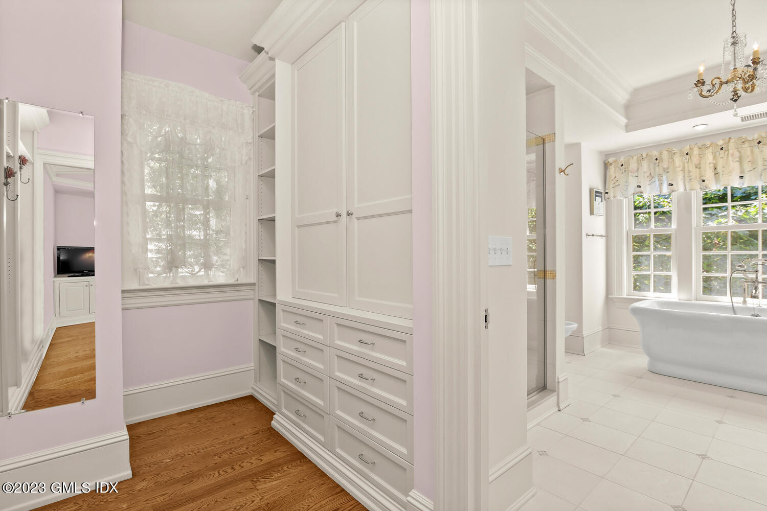 100 East Elm Street, Unit 1 Greenwich, CT 06830 - Photo 15 of 27 a view of walk in closet with hardwood floor and window