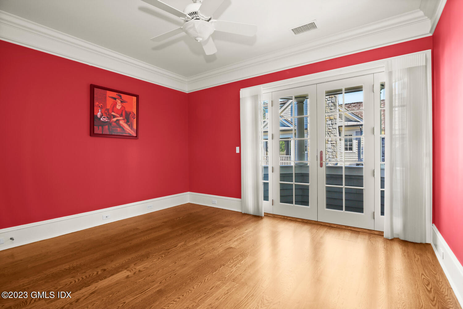 100 East Elm Street, Unit 1 Greenwich, CT 06830 - Photo 16 of 27 a view of empty room with wooden floor and fan