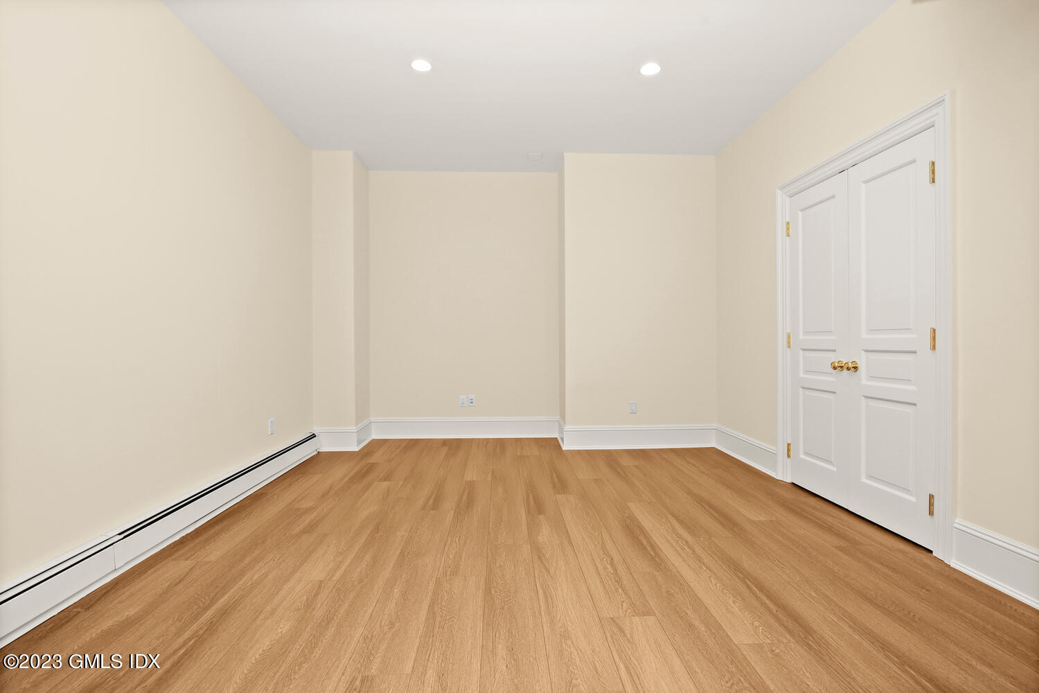 100 East Elm Street, Unit 1 Greenwich, CT 06830 - Photo 19 of 27 a view of an empty room with wooden floor