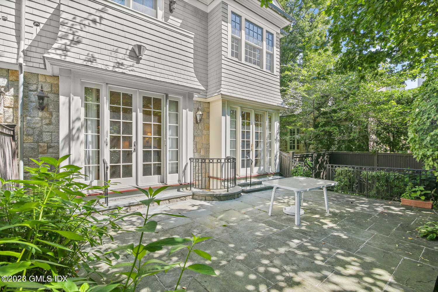 100 East Elm Street, Unit 1 Greenwich, CT 06830 - Photo 23 of 27 a view of a house with backyard and sitting area
