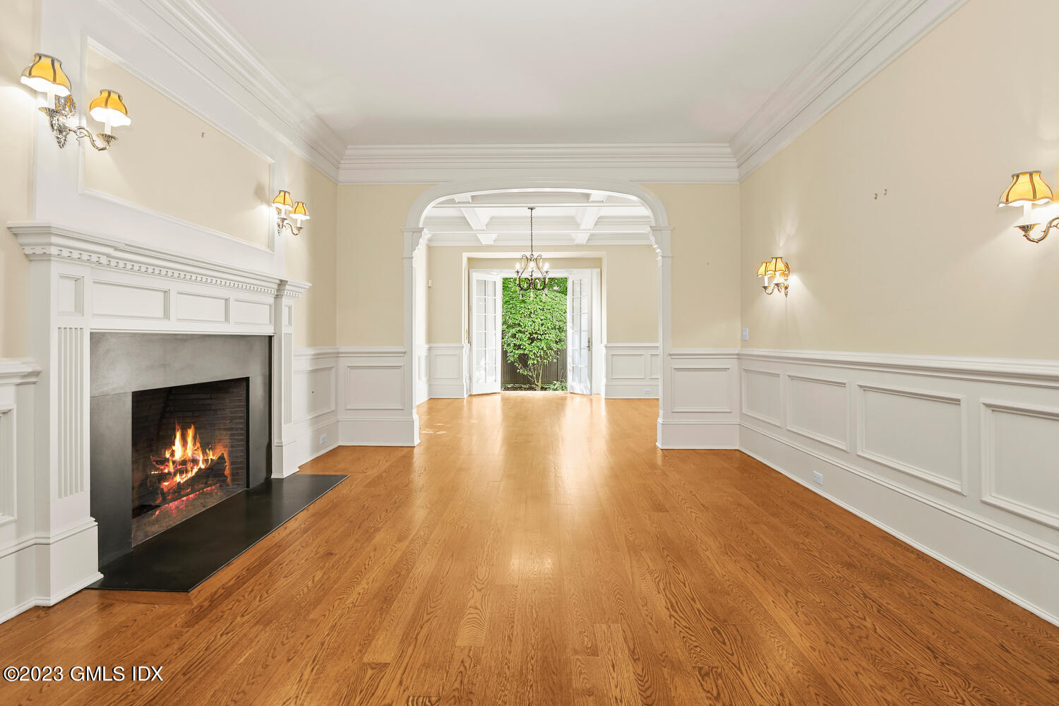 100 East Elm Street, Unit 1 Greenwich, CT 06830 - Photo 3 of 27 a view of an empty room with wooden floor fireplace and a window