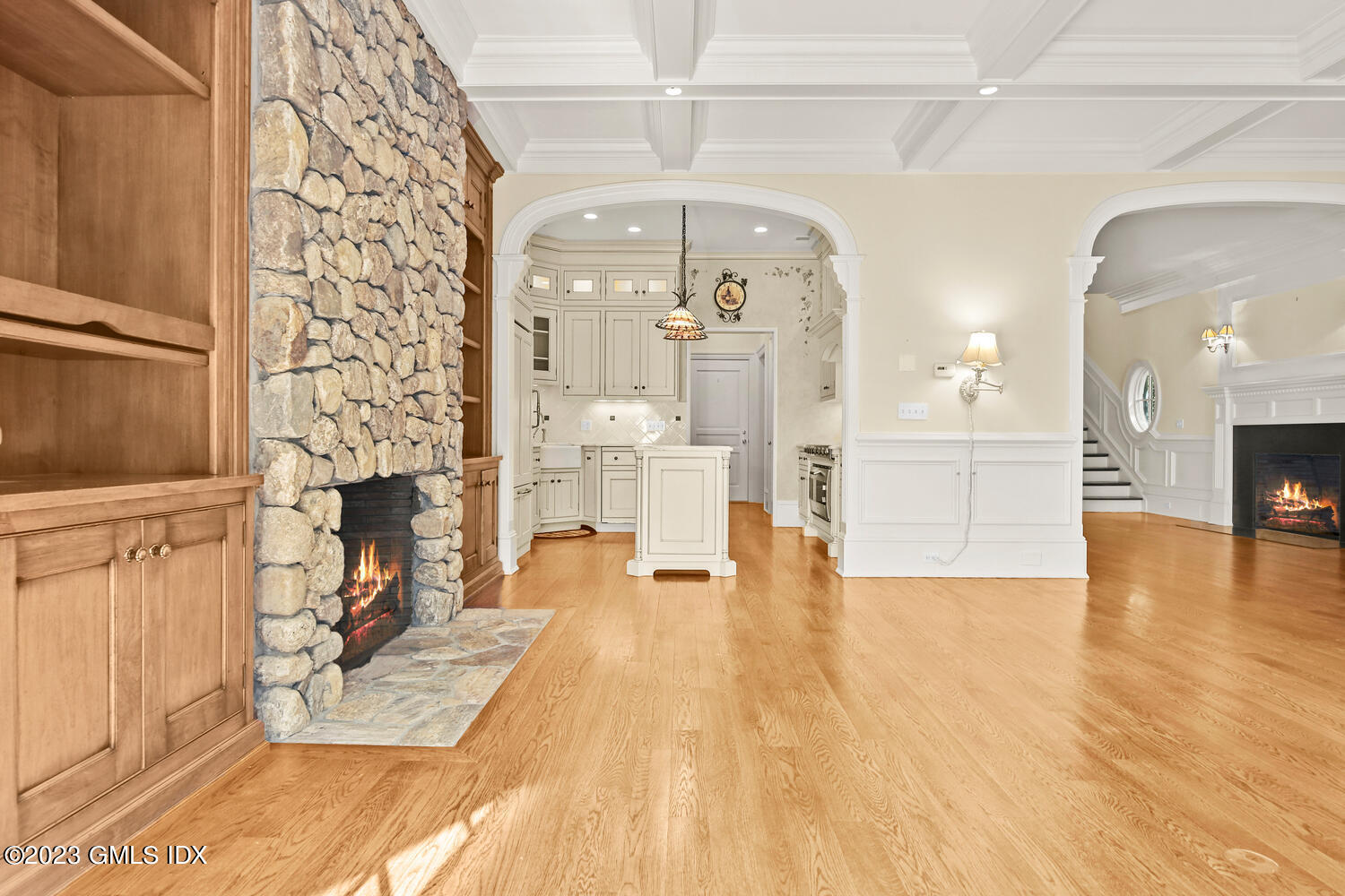 100 East Elm Street, Unit 1 Greenwich, CT 06830 - Photo 4 of 27 a view of a livingroom with furniture and a fireplace