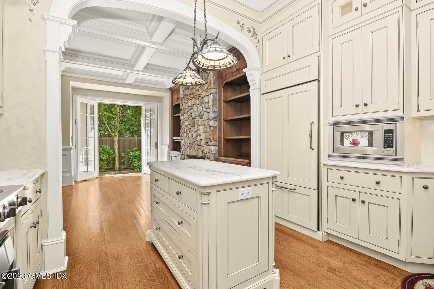 100 East Elm Street, Unit 1 Greenwich, CT 06830 - Photo 6 of 27 a view of a kitchen with cabinets and wooden floor