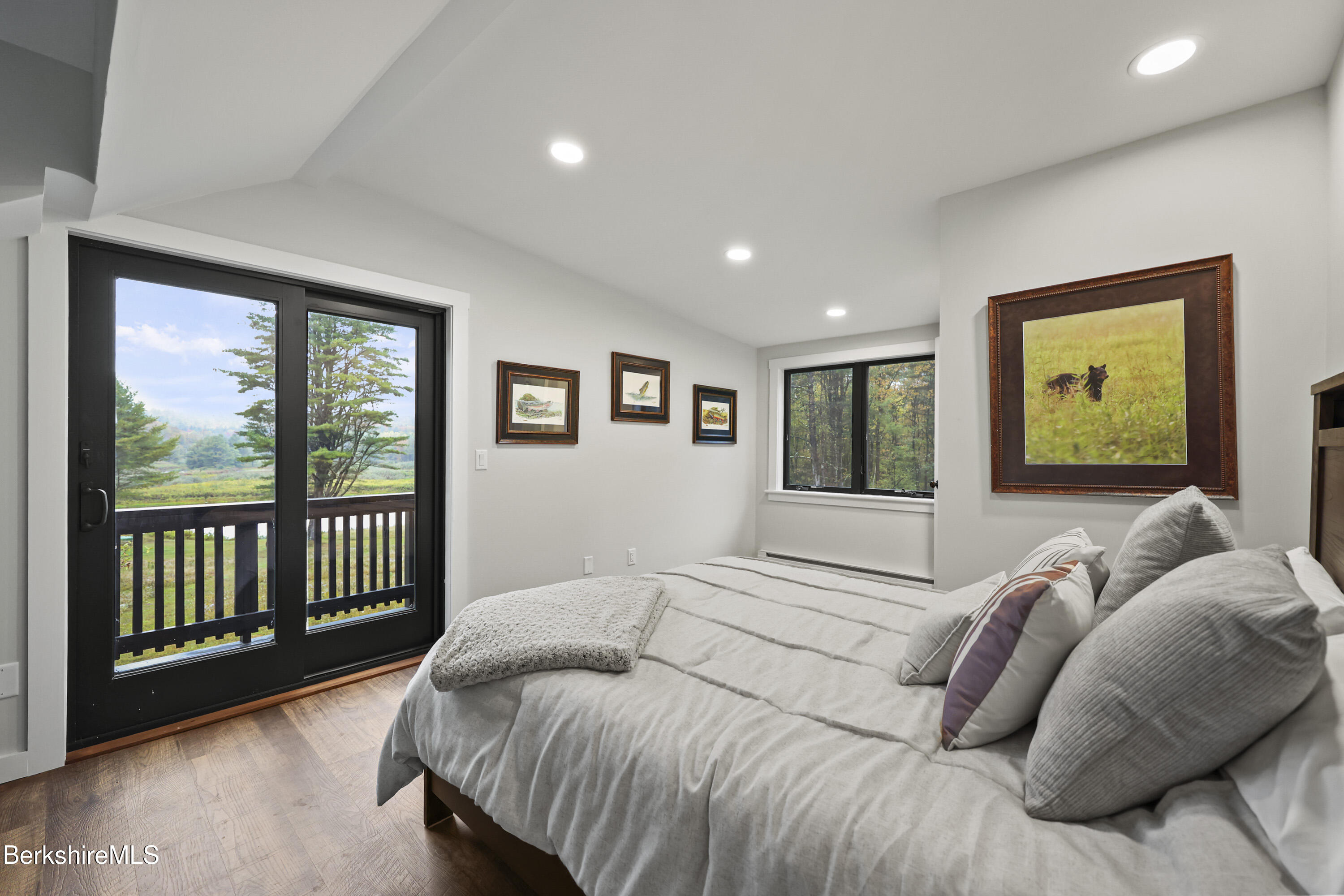 327 Chester Road Becket, MA 01223 - Photo 25 of 49 a bed sitting in a bedroom next to a window