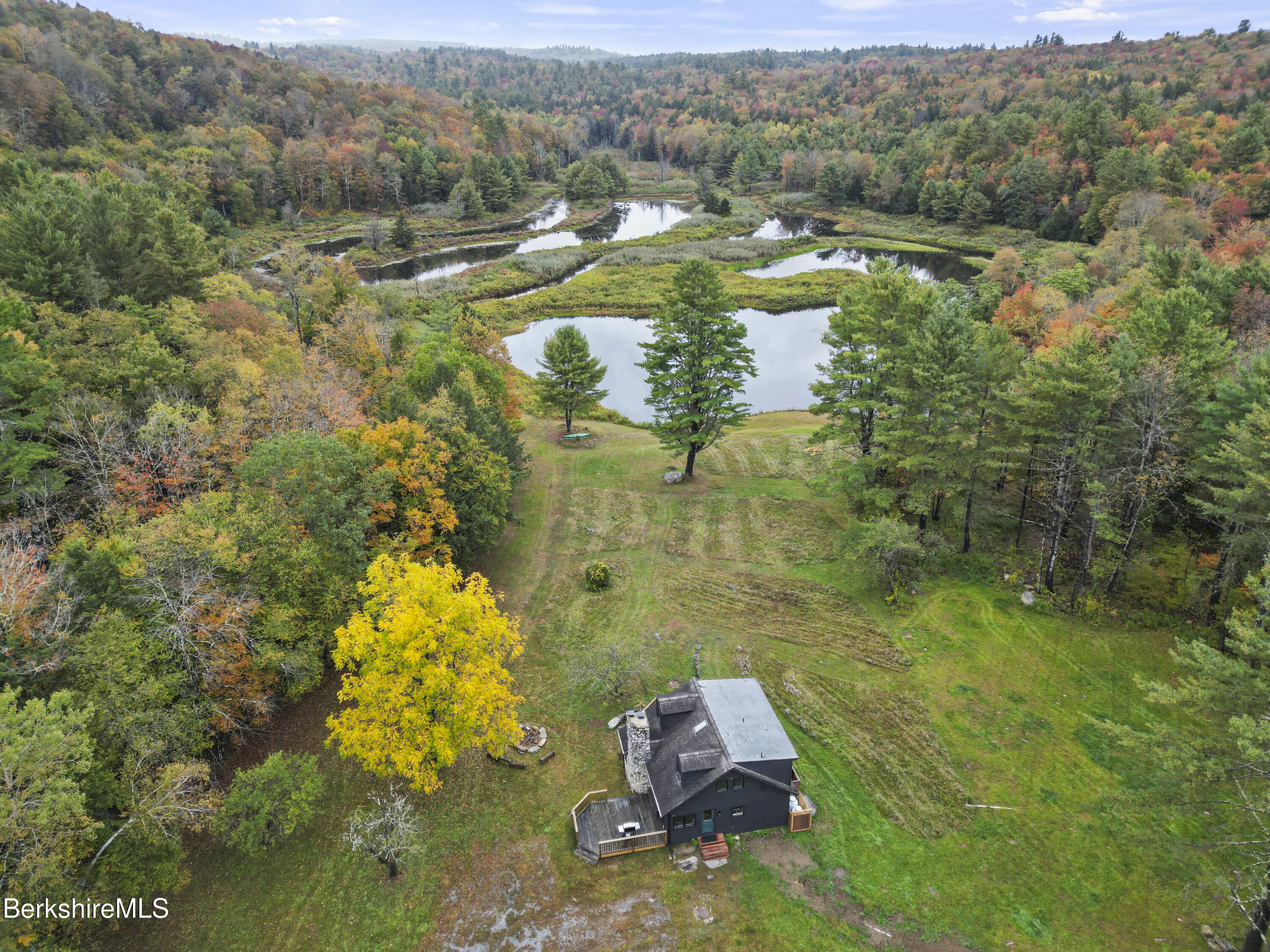 327 Chester Road Becket, MA 01223 - Photo 4 of 49 a view of a lake with a mountain
