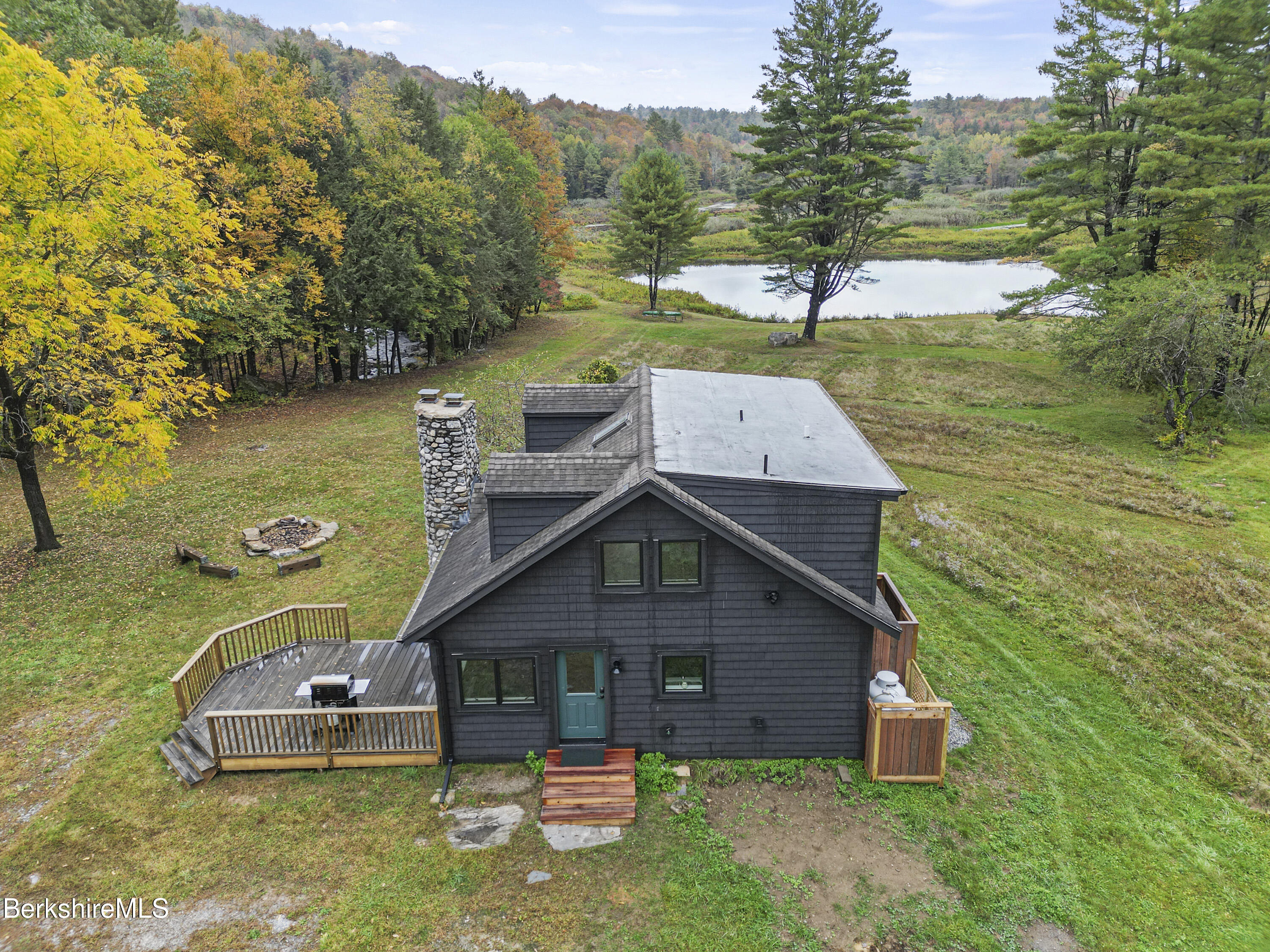 327 Chester Road Becket, MA 01223 - Photo 5 of 49 an aerial view of a house with a yard