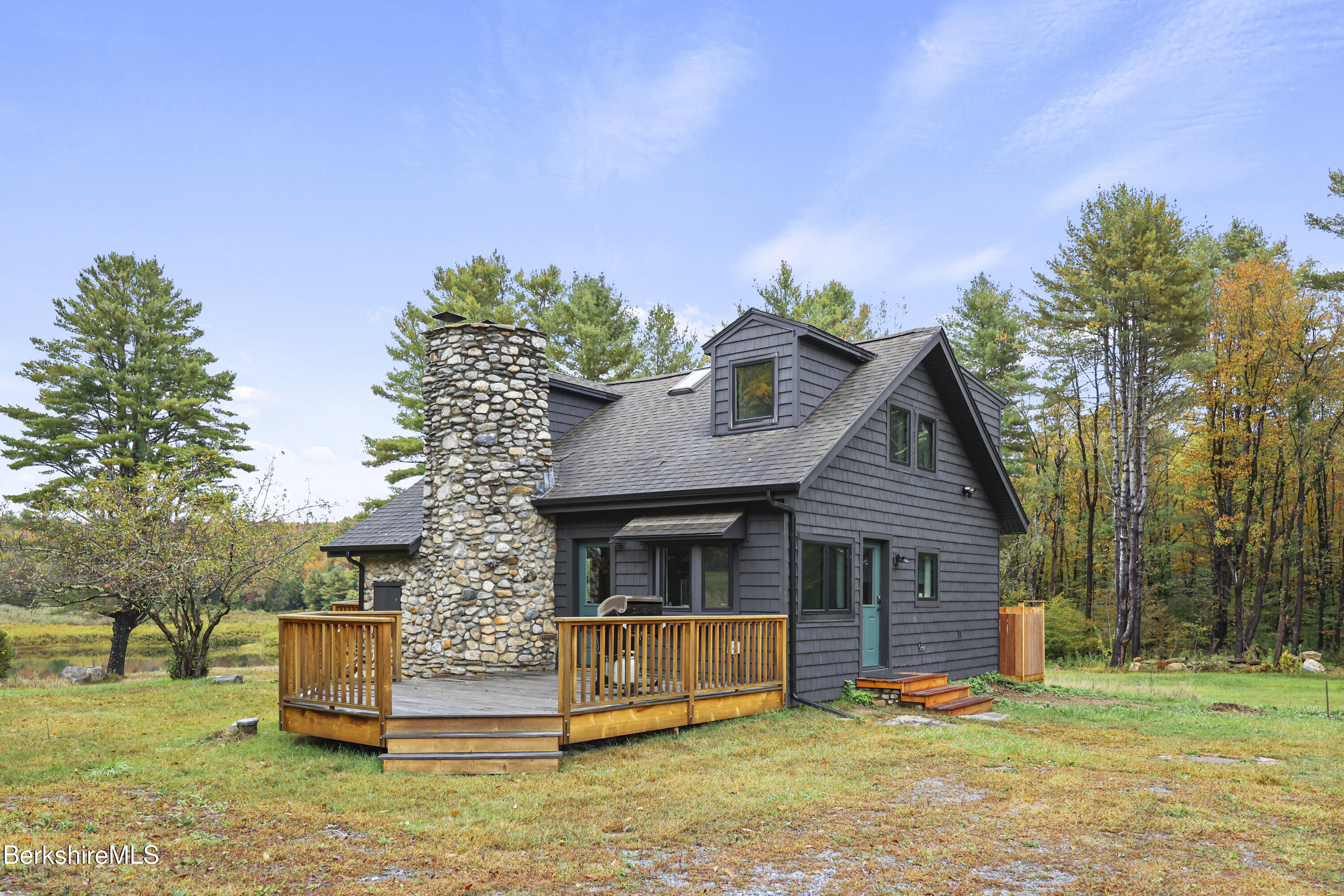 327 Chester Road Becket, MA 01223 - Photo 8 of 49 a front view of a house with a garden and trees
