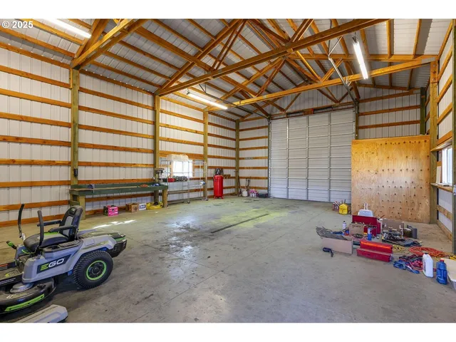 a view of a room with gym equipment and a large window