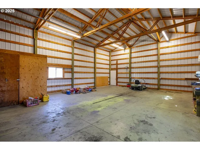 a swimming pool with yard in front of it