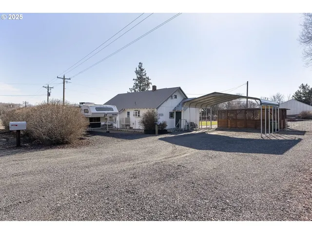 a swimming pool with outdoor seating and yard