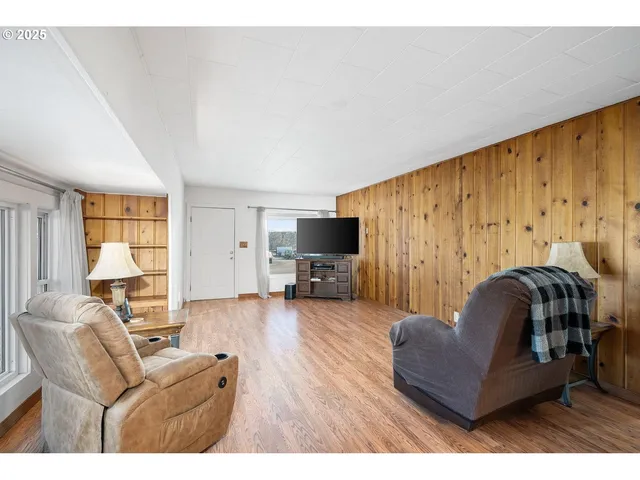 a large white kitchen with granite countertop a sink