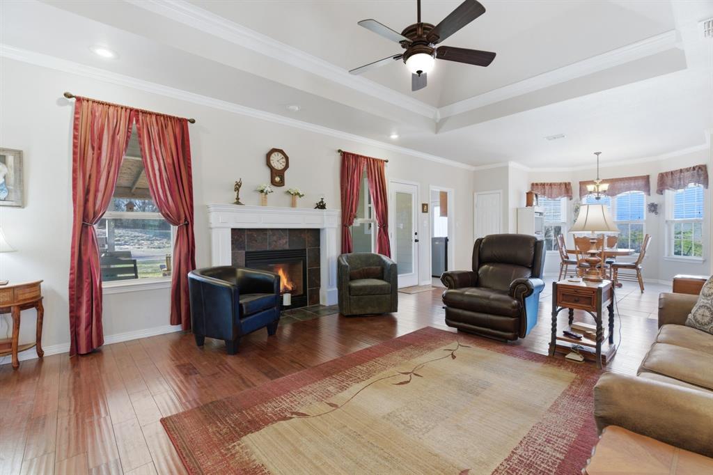 240 Johnson Bend Road Weatherford, TX 76088 - Photo 11 of 40 a living room with furniture and a fireplace