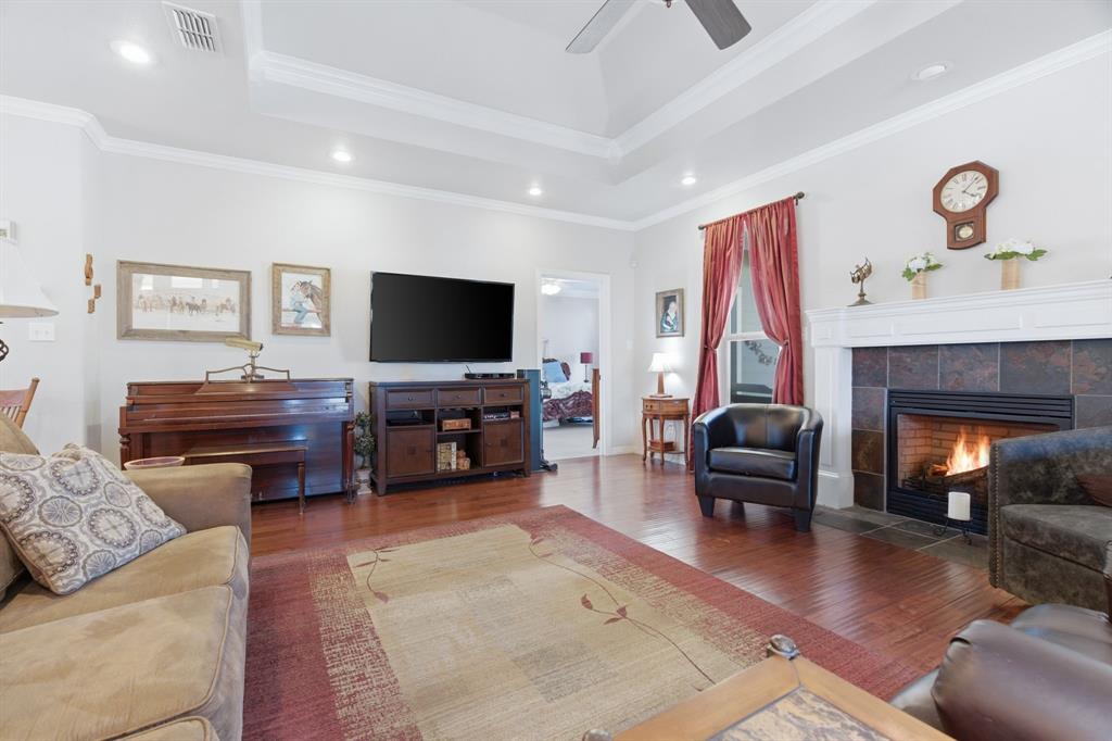 240 Johnson Bend Road Weatherford, TX 76088 - Photo 12 of 40 a living room with furniture and a fireplace