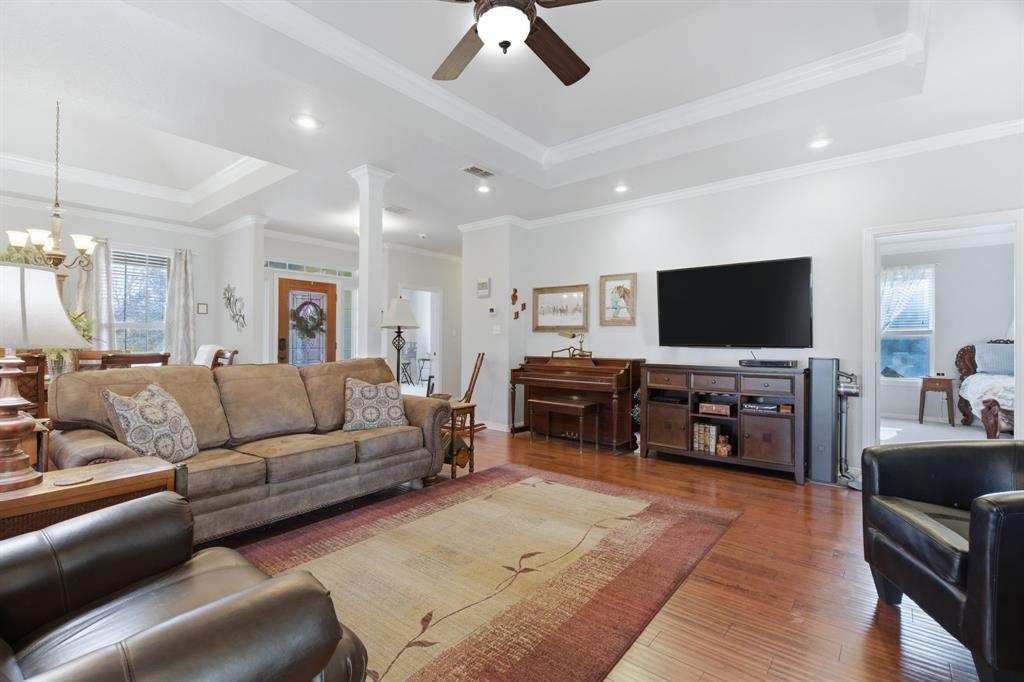 240 Johnson Bend Road Weatherford, TX 76088 - Photo 13 of 40 a living room with furniture and a flat screen tv
