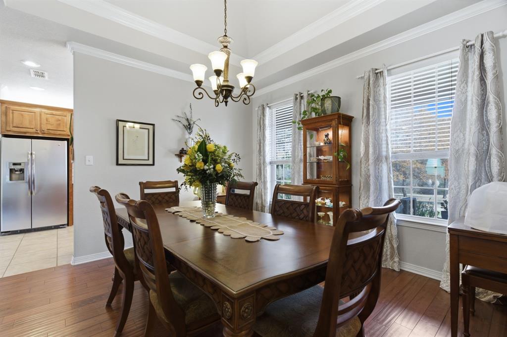 240 Johnson Bend Road Weatherford, TX 76088 - Photo 17 of 40 a view of a dining room with furniture window and wooden floor