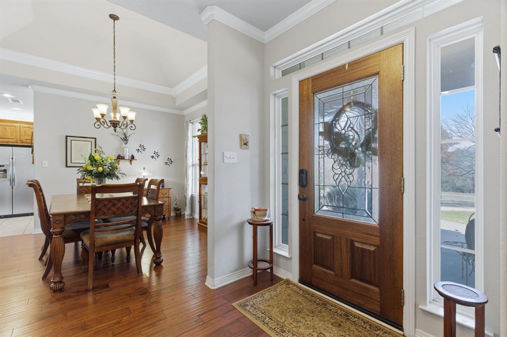 240 Johnson Bend Road Weatherford, TX 76088 - Photo 18 of 40 a view of a dining room with furniture window and wooden floor