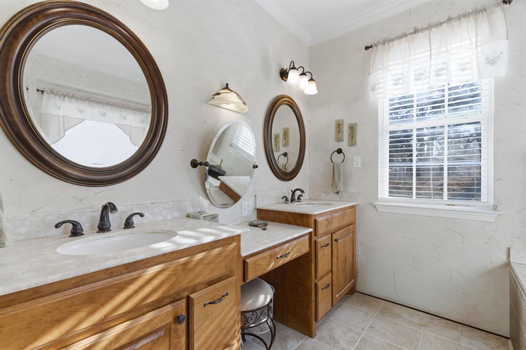 240 Johnson Bend Road Weatherford, TX 76088 - Photo 23 of 40 a bathroom with a sink and a mirror