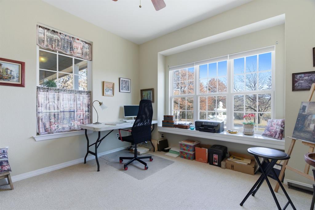 240 Johnson Bend Road Weatherford, TX 76088 - Photo 24 of 40 a view of a workspace with furniture and a window